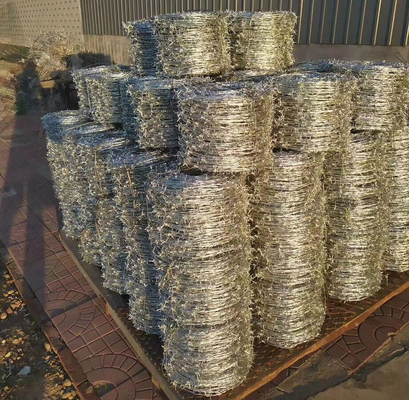 Ζυγισμένο ανοξείδωτο χάλυβα BTO22 CBT-65 Cross Concertina Razor Barbed Wire Blade Mesh Φράχτης για προστατευτική κατασκευή
